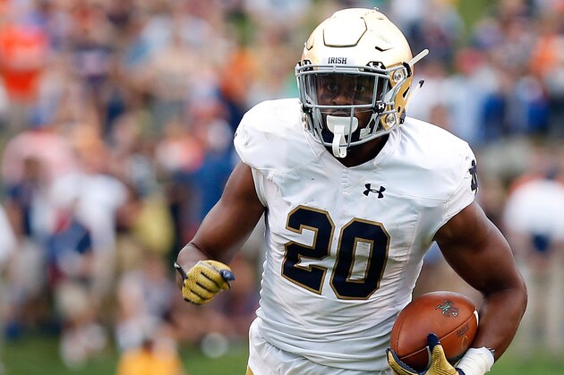 Sep 12, 2015; Charlottesville, VA, USA; Notre Dame Fighting Irish wide receiver C.J. Prosise (20) carries the ball against the Virginia Cavaliers at Scott Stadium. Mandatory Credit: Geoff Burke-USA TODAY Sports