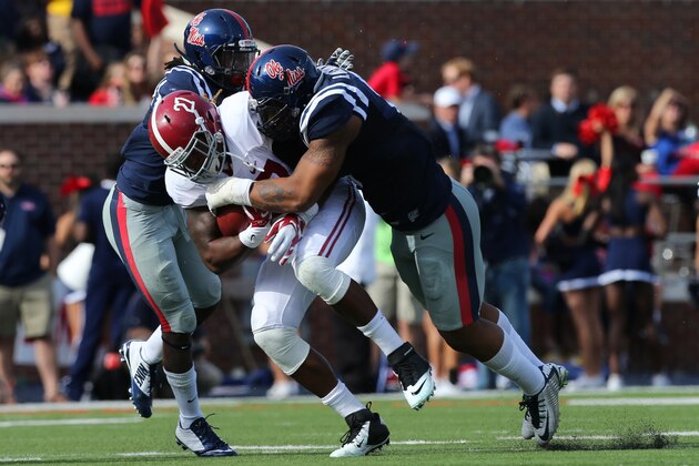 OXFORD, MS - OCTOBER 4: Robert Nkemdiche #5 of the Ole Miss Rebels tackles Derrick Henry #27 of the Alabama Crimson Tide on October 4, 2014 at Vaught-Hemingway Stadium in Oxford, Mississippi.  (Photo by Joe Murphy/Getty Images)