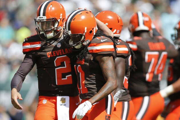 Cleveland Browns quarterback Johnny Manziel (2) celebrates with Travis Benjamin (11) after they connected for a touchdown during the first half of an NFL football game against the New York Jets Sunday, Sept. 13, 2015 in East Rutherford, N.J. (AP Photo/Kathy Willens)