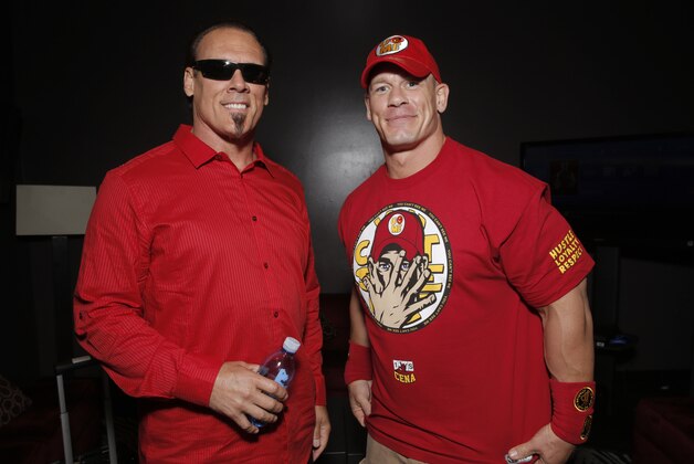 WWE 2K15 cover Superstar John Cena (right) meets with Sting backstage at the SummerSlam Confidential Panel on at Club Nokia, on Saturday, August 16, 2014 in Los Angeles. (Photo by Todd Williamson/Invision for 2K/AP Images)