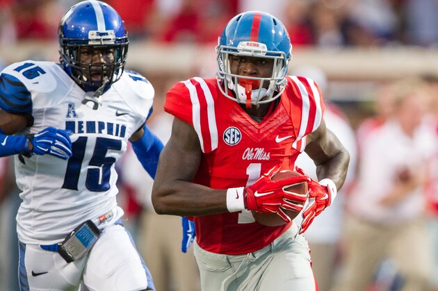 OXFORD, MS - SEPTEMBER 27:  Wide receiver Laquon Treadwell #1 of the Mississippi Rebels runs the ball downfield after catching a pass in front of defensive back Fritz Etienne #15 of the Memphis Tigers on September 27, 2014 at Vaught-Hemingway Stadium in Oxford, Mississippi. At halftime the Mississippi Rebels leads the Memphis Tigers 7-3. (Photo by Michael Chang/Getty Images)