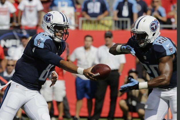 Tennessee Titans quarterback Marcus Mariota (8) hands the ball to running back Bishop Sankey (20 )during the first half of an NFL football game against the Tampa Bay Buccaneers, Sunday, Sept. 13, 2015, in Tampa, Fla. (AP Photo/Chris O'Meara)