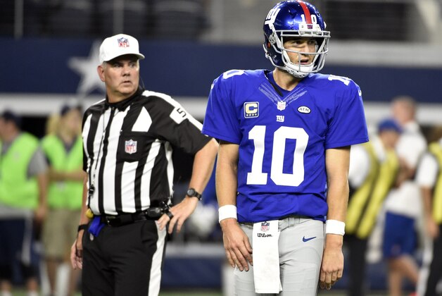 New York Giants quarterback Eli Manning (10) looks to the sideline after throwing the ball out of bounds to stop the clock during their NFL football game against the Dallas Cowboys in Arlington, Texas on September 13, 2015. (AP Photo/ Michael Ainsworth)