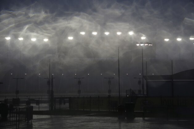 Empty grandstands are seen during a rain delay in qualifying for the NASCAR Camping World Truck Series auto race at Chicagoland Speedway, Friday, Sept. 18, 2015, in Joliet, Ill. (AP Photo/Nam Y. Huh)