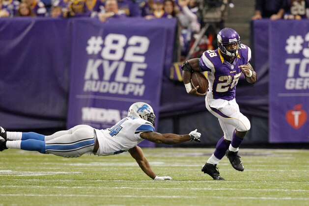 Minnesota Vikings running back Adrian Peterson (28) gains yardage as Detroit Lions strong safety Erik Coleman, left, defends during the second half of an NFL football game Sunday, Nov. 11, 2012, in Minneapolis. The Vikings won 34-24. (AP Photo/Genevieve Ross)