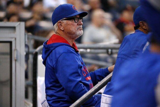 Chicago Cubs manager Joe Maddon stands in the dugout during a baseball game against the Pittsburgh Pirates in Pittsburgh, Tuesday, Sept. 15, 2015. (AP Photo/Gene J. Puskar)