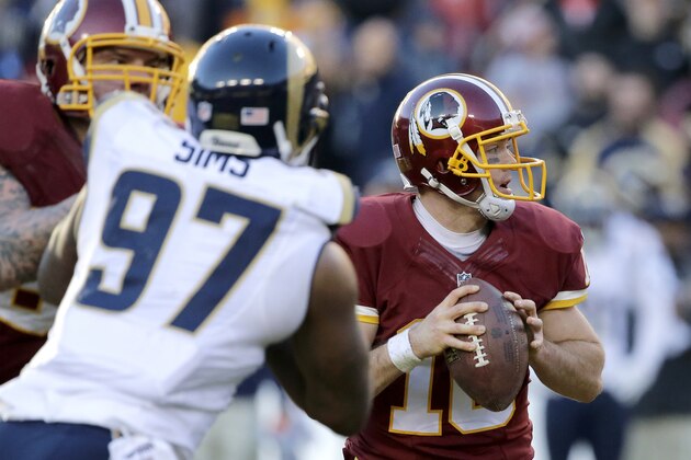 Washington Redskins quarterback Colt McCoy (16) looks for and opening to pass during the second half of an NFL football game against the St. Louis Rams in Landover, Md., Sunday, Dec. 7, 2014. (AP Photo/Mark Tenally)