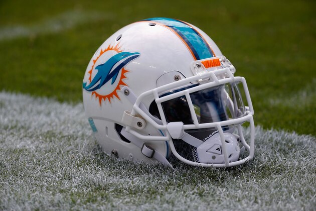 LANDOVER, MD - SEPTEMBER 13: A Miami Dolphins helmet sits on the grass before the start of their game against the Washington Redskins at FedExField on September 13, 2015 in Landover, Maryland.  (Photo by Rob Carr/Getty Images)