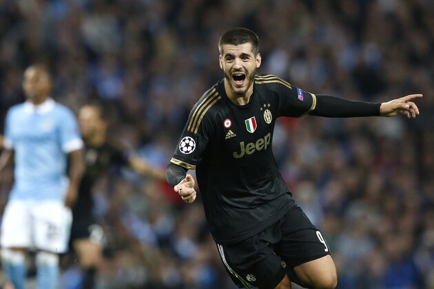 Juventus' Alvaro Morata celebrates after scoring his sides second goal during the Champions League group D soccer match between Manchester City and Juventus at the Etihad Stadium, Manchester, England, Tuesday, Sept. 15, 2015. (AP Photo/Jon Super)