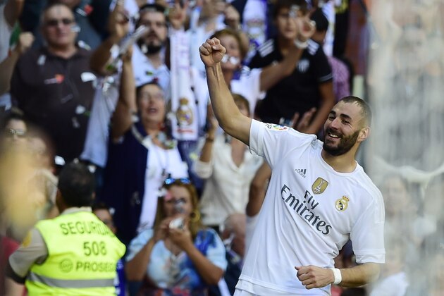 Real Madrid's French forward Karim Benzema celebrates after scoring a goal during the Spanish league football match Real Madrid CF vs Granada FC at the Santiago Bernabeu stadium in Madrid on Spetember 19, 2015.   AFP PHOTO/ JAVIER SORIANO        (Photo credit should read JAVIER SORIANO/AFP/Getty Images)