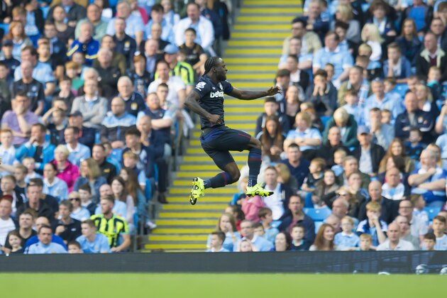 West Ham United's Victor Moses celebrates after scoring during the English Premier League soccer match between Manchester City and West Ham United at the Etihad Stadium, Manchester, England, Saturday Sept. 19, 2015. (AP Photo/Jon Super)
