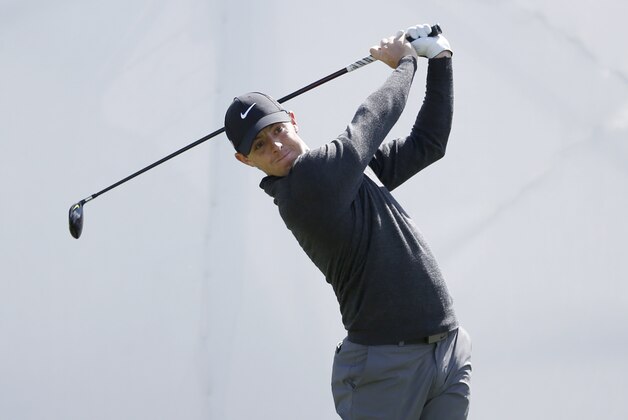 Rory McIlroy of Northern Ireland watches his tee shot on the first hole during the third round of the BMW Championship golf tournament at Conway Farms Golf Club, Saturday, Sept. 19, 2015, in Lake Forest, Ill. (AP Photo/Charles Rex Arbogast)