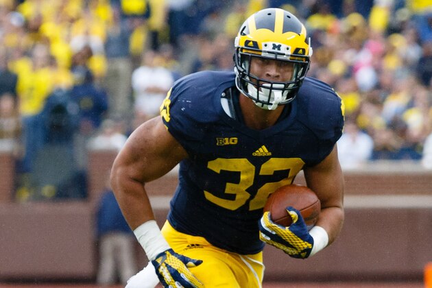 Sep 12, 2015; Ann Arbor, MI, USA; Michigan Wolverines running back Ty Isaac (32) runs the ball in the fourth quarter against the Oregon State Beavers at Michigan Stadium. Michigan won 35-7. Mandatory Credit: Rick Osentoski-USA TODAY Sports