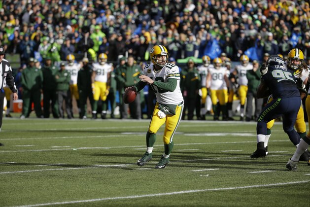 OUT OF CAMERA FILE - Green Bay Packers quarterback Aaron Rodgers (12) scrambles against the Seattle Seahawks during the first half of the NFL football NFC Championship game Sunday, Jan. 18, 2015, in Seattle. (AP Photo/Ted S. Warren)