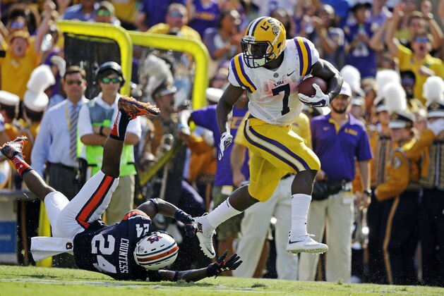 LSU running back Leonard Fournette (7)  eludes Auburn defensive back Blake Countess (24) on a 40 hard touchdown run in the first half of an NCAA college football game in Baton Rouge, La., Saturday, Sept. 19, 2015. (AP Photo/Gerald Herbert)