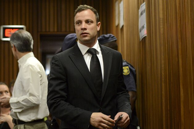 Oscar Pistorius arrives in court in Pretoria, South Africa, Tuesday, Oct. 21, 2014. Pistorius will finally learn his fate  when judge Thokozile Masipais is expected to announce the Olympic runner's sentence for killing girlfriend Reeva Steenkamp  (AP Photo/Herman Verwey, Pool)