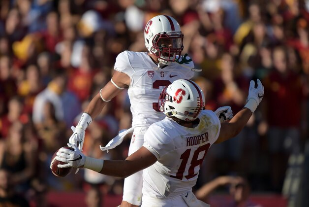 Sep 19, 2015; Los Angeles, CA, USA; Stanford Cardinal tight end Austin Hooper (18) celebrates with receiver Michael Rector (3) after scoring on a 16-yard touchdown reception in the first quarter against the Southern California Trojans at Los Angeles Memorial Coliseum. Mandatory Credit: Kirby Lee-USA TODAY Sports