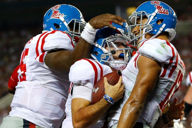 TUSCALOOSA, AL - SEPTEMBER 19:  Chad Kelly #10 of the Mississippi Rebels celebrates scoring a touchdown against the Alabama Crimson Tide with Jeremy Liggins #15 and Evan Engram #17 at Bryant-Denny Stadium on September 19, 2015 in Tuscaloosa, Alabama.  (Photo by Kevin C. Cox/Getty Images)