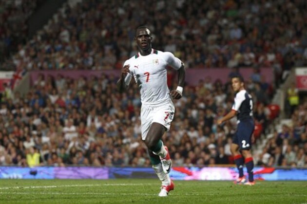 Senegal's Moussa Konate celebrates after scoring against Britain during their group A men's soccer match at the London 2012 Summer Olympics, Thursday, July 26, 2012, at Old Trafford Stadium in Manchester, England. (AP Photo/Jon Super)