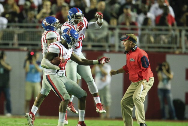 Sep 19, 2015; Tuscaloosa, AL, USA; Mississippi Rebels head coach Hugh Freeze reacts with his defense after they intercepted a pass late in the game and went on to defeated the Alabama Crimson Tide at Bryant-Denny Stadium. The Rebels defeated the Tide 43-37. Mandatory Credit: Marvin Gentry-USA TODAY Sports
