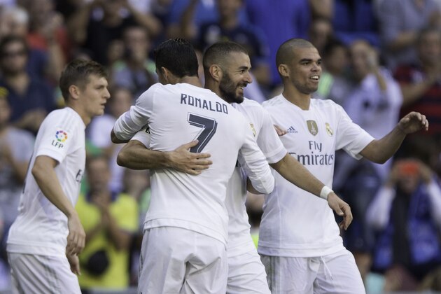 MADRID, SPAIN - SEPTEMBER 19:  Karim Benzema (2ndR) of Real Madrid CF celebrates scoring their opening goal with teammates Pepe (R), Cristiano Ronaldo (2ndL) and Toni Kroos (L) during the La Liga match between Real Madrid CF and Granada CF at Estadio Santiago Bernabeu on September 19, 2015 in Madrid, Spain.  (Photo by Gonzalo Arroyo Moreno/Getty Images)