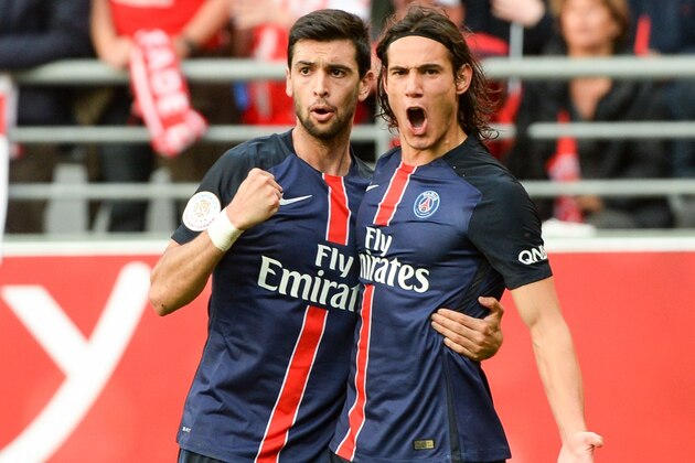 Paris Saint-Germain's Uruguayan forward Edinson Cavani (R) is congratulated by his teammate on scoring during the French Ligue 1 football  match between Reims and Paris Saint Germain (PSG) on September 19, 2015 at the Auguste Delaune stadium in Reims.  AFP PHOTO / DENIS CHARLET        (Photo credit should read DENIS CHARLET/AFP/Getty Images)