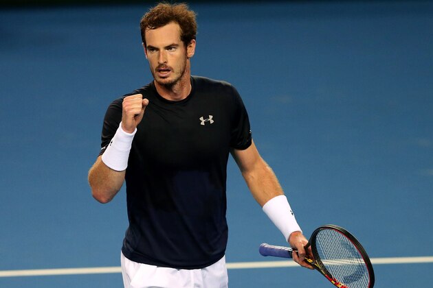 Britain's Andy Murray celebrates winning a set from Australia's Bernard Tomic during a semifinal tennis match of the Davis Cup between Britain and Australia in Glasgow, Scotland,  Sunday Sept. 20, 2015. (AP Photo/Scott Heppell)