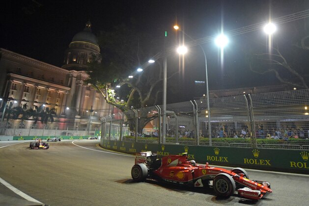 Ferrari driver Sebastian Vettel of Germany steers his car during the Singapore Formula One Grand Prix on the Marina Bay City Circuit in Singapore, Sunday, Sept. 20, 2015.(AP Photo/Joseph Nair)