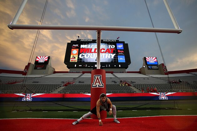 TUCSON, AZ - SEPTEMBER 19: Wide receiver Alex Holmes #14 of the Northern Arizona Lumberjacks stretches before the start of the college football game against the Arizona Wildcats at Arizona Stadium on September 19, 2015 in Tucson, Arizona. (Photo by Chris Coduto/Getty Images)