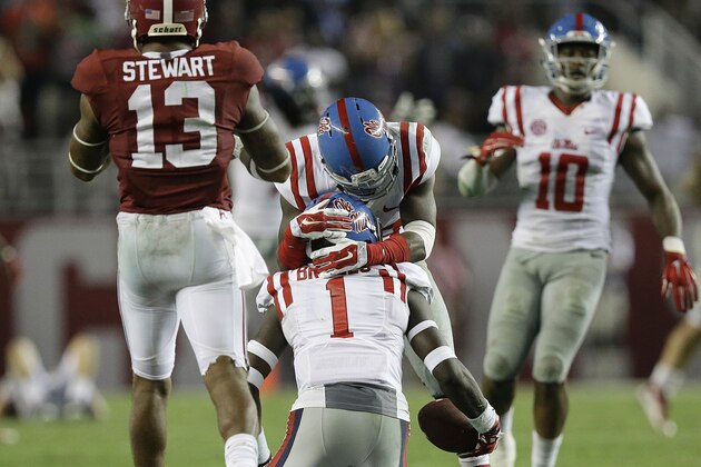 Mississippi defensive back Mike Hilton (38) celebrates with teammate Tony Bridges (1) after he intercepts the ball intended for Alabama wide receiver ArDarius Stewart (13) during second half of an NCAA college football game, Saturday, Sept. 19, 2015, in Tuscaloosa, Ala. (AP Photo/Brynn Anderson)