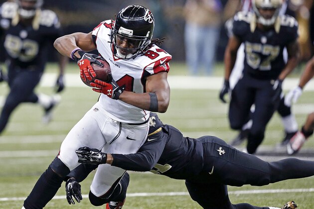 Atlanta Falcons running back Devonta Freeman (24) carries for a gain in the second half of an NFL football game against the New Orleans Saints in New Orleans, Sunday, Dec. 21, 2014. (AP Photo/Rogelio Solis)