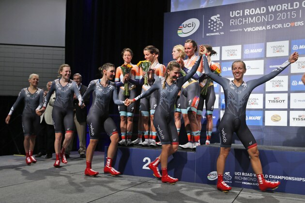 Winners of the women's team time trial for the UCI Road World Championships, SRAM Velocio, arrive on the winners stage for medal presentations in Richmond, Va., Sunday, Sept. 20, 2015.   (AP Photo/Steve Helber)