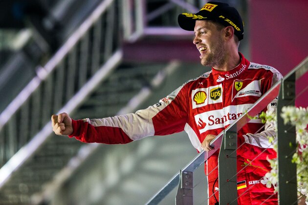 SINGAPORE - SEPTEMBER 20: Sebastian Vettel of Ferrari and Germany during the Formula One Grand Prix of Singapore at Marina Bay Street Circuit on September 20, 2015 in Singapore.  (Photo by Peter J Fox/Getty Images)