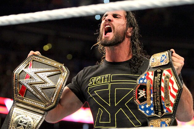 Seth Rollins with the U.S. and WWE World Championships