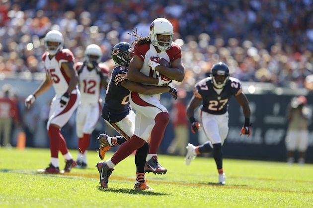 Arizona Cardinals wide receiver Larry Fitzgerald (11) runs against Chicago Bears cornerback Kyle Fuller (23) during the second half of an NFL football game, Sunday, Sept. 20, 2015, in Chicago. (AP Photo/Michael Conroy)