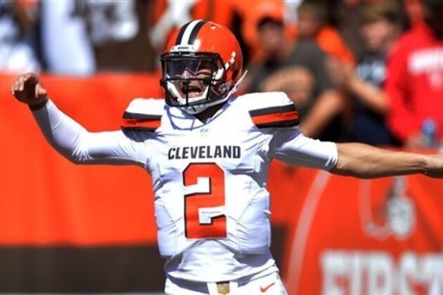 Cleveland Browns quarterback Johnny Manziel celebrates after a 60-yard touchdown pass to wide receiver Travis Benjamin in the first half of an NFL football game against the Tennessee Titans, Sunday, Sept. 20, 2015, in Cleveland. (AP Photo/David Richard)