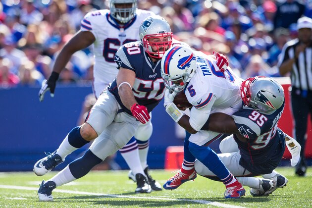 ORCHARD PARK, NY - SEPTEMBER 20:  Chandler Jones #95 sacks Tyrod Taylor #5 of the Buffalo Bills with help from Rob Ninkovich #50 of the New England Patriots during the second half on September 20, 2015 at Ralph Wilson Stadium in Orchard Park, New York.  New England defeats Buffalo 40-32.  (Photo by Brett Carlsen/Getty Images)