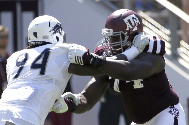 Texas A&M offensive lineman Germain Ifedi (74) blocks Nevada defensive end Lenny Jones (94) during the first half of an NCAA college football game Saturday, Sept. 19, 2015, in College Station, Texas. (AP Photo/David J. Phillip)
