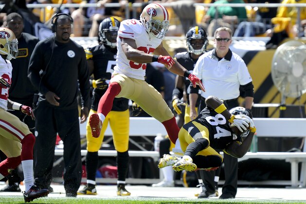 Pittsburgh Steelers wide receiver Antonio Brown (84) makes a catch past San Francisco 49ers free safety Eric Reid (35) in the first quarter of an NFL football game, Sunday, Sept. 20, 2015 in Pittsburgh. (AP Photo/Keith Srakocic)