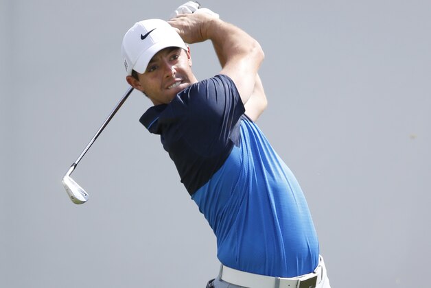 Rory McIlroy, of Northern Ireland, watches his tee shot on the first hole during the final round of the BMW Championship golf tournament at Conway Farms Golf Club, Sunday, Sept. 20, 2015, in Lake Forest, Ill. (AP Photo/Charles Rex Arbogast)