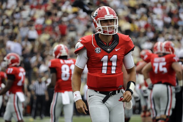 Georgia quarterback Greyson Lambert walks to the sideline in the first half of an NCAA college football game against Vanderbilt Saturday, Sept. 12, 2015, in Nashville, Tenn. (AP Photo/Mark Humphrey)