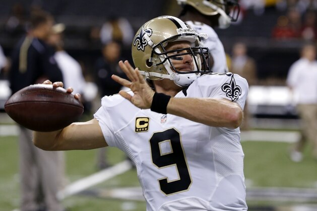 New Orleans Saints quarterback Drew Brees (9) warms up before an NFL football game against the Tampa Bay Buccaneers in New Orleans, Sunday, Sept. 20, 2015. (AP Photo/Jonathan Bachman)