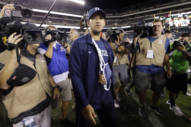 Injured Dallas Cowboys quarterback Tony Romo walks the field after an NFL football game against the Philadelphia Eagles, Sunday, Sept. 20, 2015, in Philadelphia. Dallas won 20-10. (AP Photo/Matt Rourke)