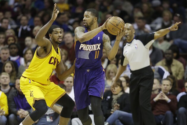 Phoenix Suns' Markieff Morris (11) is defended by Cleveland Cavaliers' Tristan Thompson in an NBA basketball game Sunday, Jan. 26, 2014, in Cleveland. (AP Photo/Mark Duncan)
