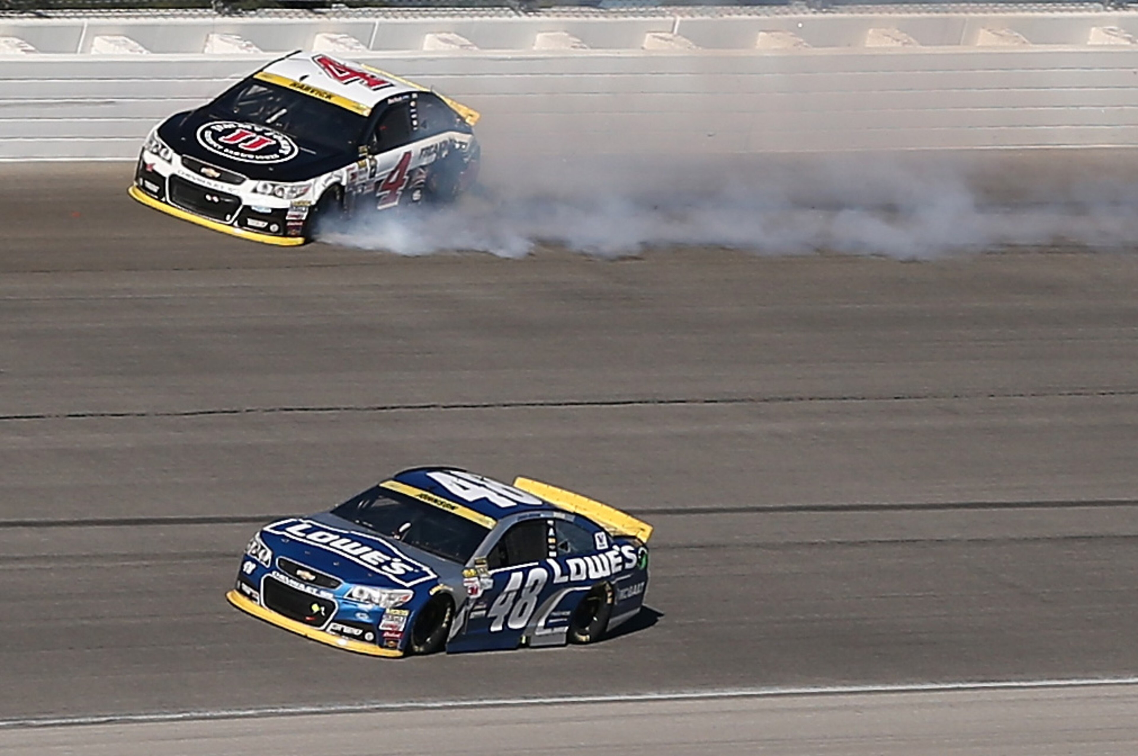 JOLIET, IL - SEPTEMBER 20: Kevin Harvick, driver of the #4 Jimmy John's / Budweiser Chevrolet, spins after contact with Jimmie Johnson, driver of the #48 Lowe's Chevrolet, during the NASCAR Sprint Cup Series myAFibRisk.com 400 at Chicagoland Speedway on September 20, 2015 in Joliet, Illinois. (Photo by Jonathan Daniel/Getty Images) JOLIET, IL - SEPTEMBER 20: Kevin Harvick, driver of the #4 Jimmy John's / Budweiser Chevrolet, spins after contact with Jimmie Johnson, driver of the #48 Lowe's Chevrolet, during the NASCAR Sprint Cup Series myAFibRisk.com 400 at Chicagoland Speedway on September 20, 2015 in Joliet, Illinois. (Photo by Jonathan Daniel/Getty Images)
