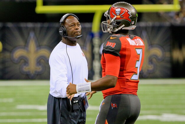Sep 20, 2015; New Orleans, LA, USA;  Tampa Bay Buccaneers head coach Lovie Smith (L) talks to quarterback Jameis Winston (3) during the second half against the New Orleans Saints at the Mercedes-Benz Superdome. The Buccaneers won 26-19. Mandatory Credit: Derick E. Hingle-USA TODAY Sports