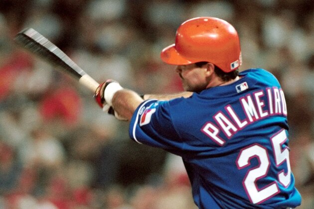 Texas Rangers' Rafael Palmeiro hits his 389th career home run against the Detroit Tigers in the sixth inning in Arlington, Texas, Saturday, July 29, 2000. The homer tied Palmiero with Johnny Bench for 36th on the career list. (AP Photo/Linda Kaye)