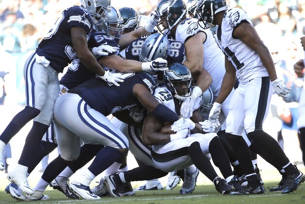 Philadelphia Eagles' DeMarco Murray (29) is tackled during the first half of an NFL football game against the Dallas Cowboys, Sunday, Sept. 20, 2015, in Philadelphia. (AP Photo/Michael Perez)
