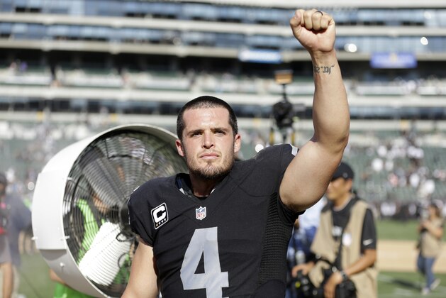 Oakland Raiders quarterback Derek Carr celebrates after a 37-33 win over the Baltimore Ravens during an NFL football game Sunday, Sept. 20, 2015, in Oakland, Calif. (AP Photo/Ben Margot)
