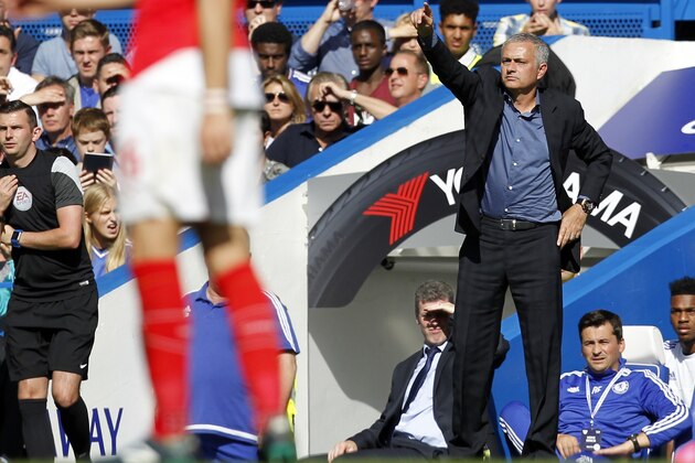 Chelsea's Portuguese manager Jose Mourinho (R) gestures during the English Premier League football match between Chelsea and Arsenal at Stamford Bridge in London on September 19, 2015. AFP PHOTO / IAN KINGTON

RESTRICTED TO EDITORIAL USE. No use with unauthorized audio, video, data, fixture lists, club/league logos or 'live' services. Online in-match use limited to 75 images, no video emulation. No use in betting, games or single club/league/player publications.        (Photo credit should read IAN KINGTON/AFP/Getty Images)